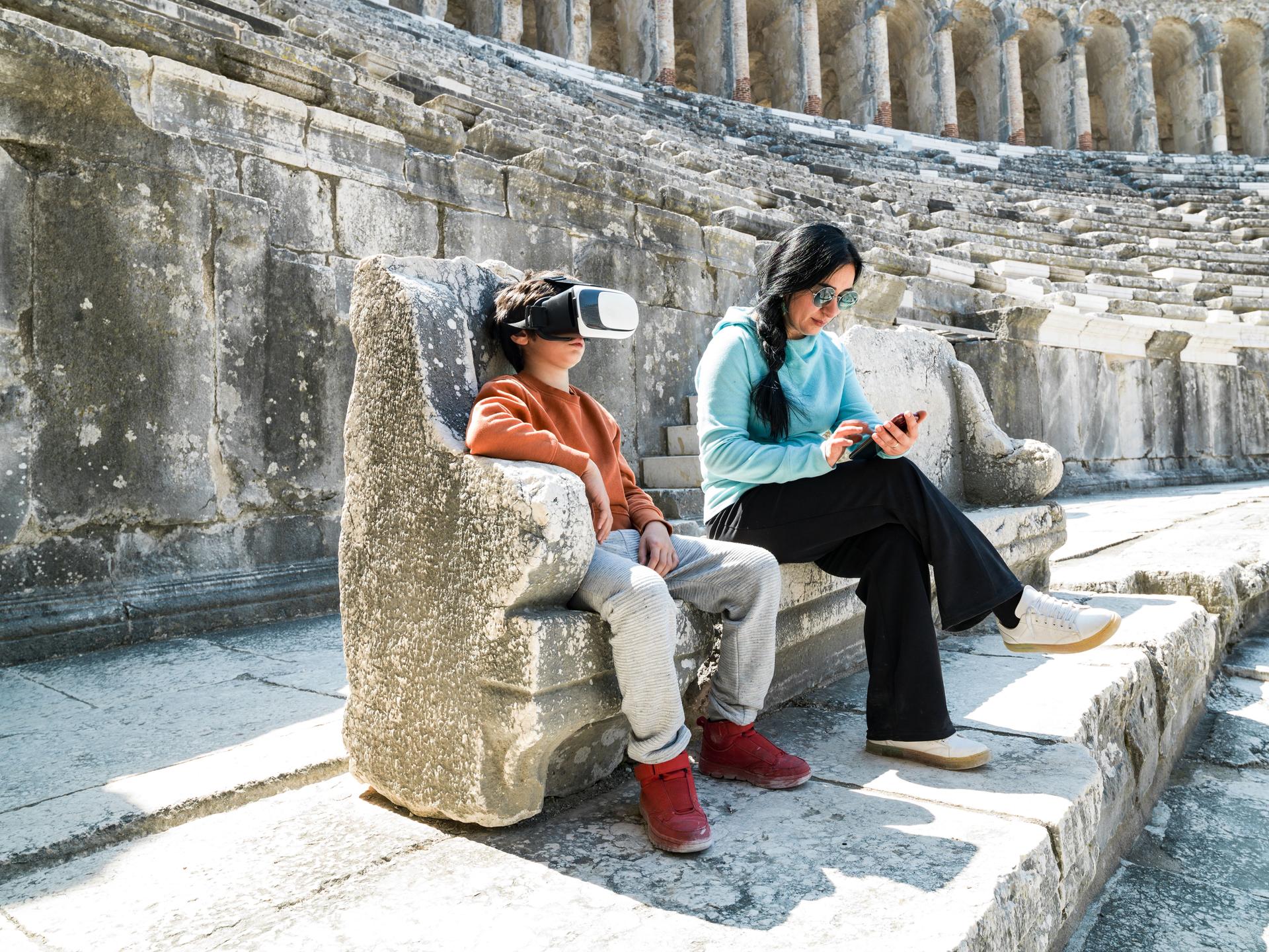 Photo of mother and son exploring ancient city of Aspendos